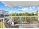 Relaxing balcony with comfortable seating and a peaceful view of the surrounding landscaping at 14290 Ocean Highway # 222, Pawleys Island, SC 29585
