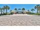 Community clubhouse exterior with well-maintained landscaping and a paved entry at 14290 Ocean Highway # 222, Pawleys Island, SC 29585