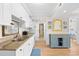 Bright kitchen featuring white cabinetry, granite countertops, and modern appliances at 14290 Ocean Highway # 222, Pawleys Island, SC 29585