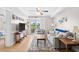 Bright living room features comfortable seating and access to a balcony overlooking outdoor scenery at 14290 Ocean Highway # 222, Pawleys Island, SC 29585
