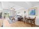 Cozy living room with comfortable seating, dining area, and a balcony overlooking lush greenery at 14290 Ocean Highway # 222, Pawleys Island, SC 29585