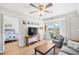 Open-concept living room with comfortable seating, a balcony, and a view into the bedroom at 14290 Ocean Highway # 222, Pawleys Island, SC 29585