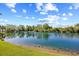 Scenic view of a tranquil pond reflecting the clear blue sky and lush green landscape at 14290 Ocean Highway # 222, Pawleys Island, SC 29585