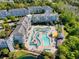 Aerial view of community pool and amenities, highlighting spacious decks and lush landscaping at 14290 Ocean Highway # 222, Pawleys Island, SC 29585