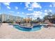 Community swimming pool with various water features at 14290 Ocean Highway # 222, Pawleys Island, SC 29585