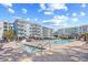 Community swimming pool and hot tub, with lounge chairs, near the condominiums at 14290 Ocean Highway # 222, Pawleys Island, SC 29585