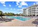 Community swimming pool with lounge chairs overlooking the condominiums at 14290 Ocean Highway # 222, Pawleys Island, SC 29585