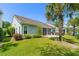 Well-maintained backyard with green lawn, trees and screened-in porch at 1470 Suncrest Dr., Myrtle Beach, SC 29577