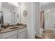 Shared bath with vanity and framed mirror with shower/tub combination nearby, and decorative art at 1470 Suncrest Dr., Myrtle Beach, SC 29577