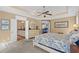 This main bedroom includes an en-suite bathroom with an elegant ceiling fan at 1470 Suncrest Dr., Myrtle Beach, SC 29577