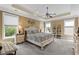Spacious main bedroom filled with natural light and offers a decorative ceiling fan at 1470 Suncrest Dr., Myrtle Beach, SC 29577