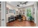 Inviting home office with hardwood floors, ceiling fan, and a large window for plenty of natural light at 1470 Suncrest Dr., Myrtle Beach, SC 29577