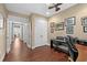 Home office featuring hardwood floors, neutral paint, piano, with access to hallway and secondary room at 1470 Suncrest Dr., Myrtle Beach, SC 29577
