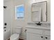 Bright bathroom with vanity and view of window at 1503 Red Bluff Rd., Loris, SC 29569