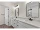 Double vanity bathroom features updated hardware, lighting, and framed mirrors at 1503 Red Bluff Rd., Loris, SC 29569
