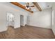 Large bedroom with hardwood floors, ceiling fan, and a bathroom at 1503 Red Bluff Rd., Loris, SC 29569