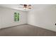 Bright bedroom features neutral walls, plush carpeting, and ceiling fan at 1503 Red Bluff Rd., Loris, SC 29569