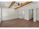 Spacious bedroom featuring hardwood floors, a ceiling fan and two closets at 1503 Red Bluff Rd., Loris, SC 29569