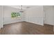 Formal dining room with large window, hardwood floors, and wainscoting, perfect for entertaining guests at 1503 Red Bluff Rd., Loris, SC 29569