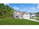 Inviting one-story home featuring a lush lawn, attached two-car garage and manicured landscaping at 1503 Red Bluff Rd., Loris, SC 29569