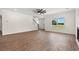 Bright, open living space with large windows and modern finishes, hardwood floors and staircase nearby at 1503 Red Bluff Rd., Loris, SC 29569