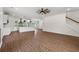 Spacious open-concept living and kitchen area with pendant lighting and hardwood floors throughout at 1503 Red Bluff Rd., Loris, SC 29569