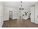 Open-concept living area featuring wood floors, a kitchen island, and lots of natural light at 1503 Red Bluff Rd., Loris, SC 29569