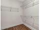 Walk-in closet features wood floors and ample storage shelving at 1503 Red Bluff Rd., Loris, SC 29569