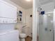 Functional bathroom featuring a shower, toilet, and stacked washer/dryer at 1521 Front St., Georgetown, SC 29440