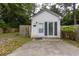 Exterior of a small building on a property with fencing and a cement pad at 1521 Front St., Georgetown, SC 29440
