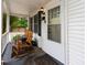 Charming front porch with rocking chairs, a welcoming entrance, and curb appeal at 1521 Front St., Georgetown, SC 29440