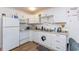 Clean, bright kitchen with white cabinetry and granite countertops at 1521 Front St., Georgetown, SC 29440