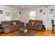 Cozy living room featuring two couches, natural light, and hardwood flooring at 1521 Front St., Georgetown, SC 29440