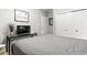 Bedroom with a gray bedspread, a glass table and light walls at 1525 Lanterns Rest Rd. # 103, Myrtle Beach, SC 29579