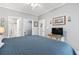 Bright bedroom with ensuite bathroom, closet, and TV on dresser at 1525 Lanterns Rest Rd. # 103, Myrtle Beach, SC 29579