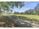 Lush green golf course framed by trees, offering a serene and picturesque view of the community at 1525 Lanterns Rest Rd. # 103, Myrtle Beach, SC 29579