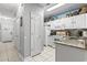 Well-lit kitchen with white cabinetry, granite countertops, and modern appliances at 1525 Lanterns Rest Rd. # 103, Myrtle Beach, SC 29579
