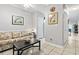 Cozy living room with neutral walls, decorative artwork, and tiled floors at 1525 Lanterns Rest Rd. # 103, Myrtle Beach, SC 29579
