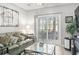 Living room with tile floors, sliding glass doors to patio, and relaxed coastal decor at 1525 Lanterns Rest Rd. # 103, Myrtle Beach, SC 29579