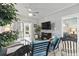 Bright living area with a sliding door to the patio, flat screen tv, and comfortable seating at 1525 Lanterns Rest Rd. # 103, Myrtle Beach, SC 29579