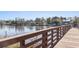 Charming waterfront view from a wooden pier overlooking serene water and waterfront residences at 1525 Lanterns Rest Rd. # 103, Myrtle Beach, SC 29579