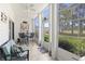 Bright sunroom with multiple windows, a ceiling fan, and an outdoor view at 1525 Lanterns Rest Rd. # 103, Myrtle Beach, SC 29579