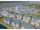 Breathtaking aerial view of beachside homes with ponds, landscaping, and stunning ocean views at 156 Via Old Sound Blvd. # C, Ocean Isle Beach, NC 28469