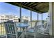 Relaxing balcony with coastal views and seating arrangement for outdoor enjoyment at 156 Via Old Sound Blvd. # C, Ocean Isle Beach, NC 28469
