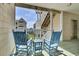 Inviting balcony with rocking chairs and scenic views for relaxing and enjoying the outdoors at 156 Via Old Sound Blvd. # C, Ocean Isle Beach, NC 28469