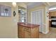 Convenient bar area near kitchen equipped with sink, storage cabinets, and shelving for glassware and drinks at 156 Via Old Sound Blvd. # C, Ocean Isle Beach, NC 28469