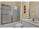Bathroom featuring a toilet, shower/tub, sink, and a sliding glass shower door at 156 Via Old Sound Blvd. # C, Ocean Isle Beach, NC 28469