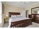 Bedroom showcasing a wooden sleigh bed, complementing lamps, and dresser at 156 Via Old Sound Blvd. # C, Ocean Isle Beach, NC 28469