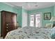 Comfortable bedroom showcasing a queen bed, ceiling fan, and balcony access at 156 Via Old Sound Blvd. # C, Ocean Isle Beach, NC 28469