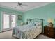 Charming bedroom featuring a queen bed, ceiling fan, and outdoor access at 156 Via Old Sound Blvd. # C, Ocean Isle Beach, NC 28469